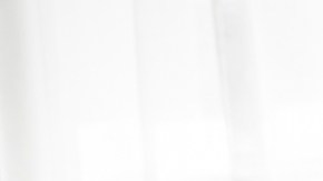 A mother and daughter sitting on sofa at home talking