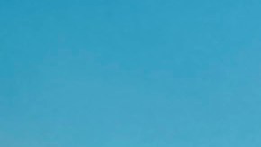 Evening view of historic downtown Detroit seeing the Detroit river, Belle Isle, and Windsor