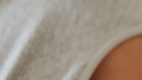Black couple, love and bedroom romance while happy and intimate on a bed at home, apartment or hotel to relax. Face of a young man and woman in a happy marriage with commitment, trust and care
