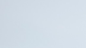 A couple sharing a delightful lunch at a beachside restaurant, enjoying quality time and sunshine by the ocean. Perfect scene of romance and relaxation.